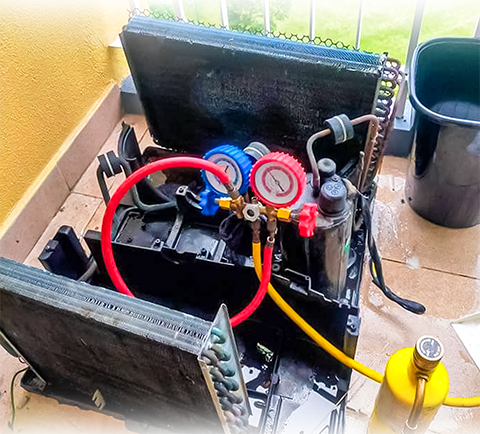 Technicians installing and servicing an Window AC unit for optimal cooling and performance.